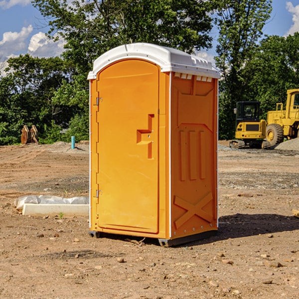 what is the cost difference between standard and deluxe portable restroom rentals in Wing